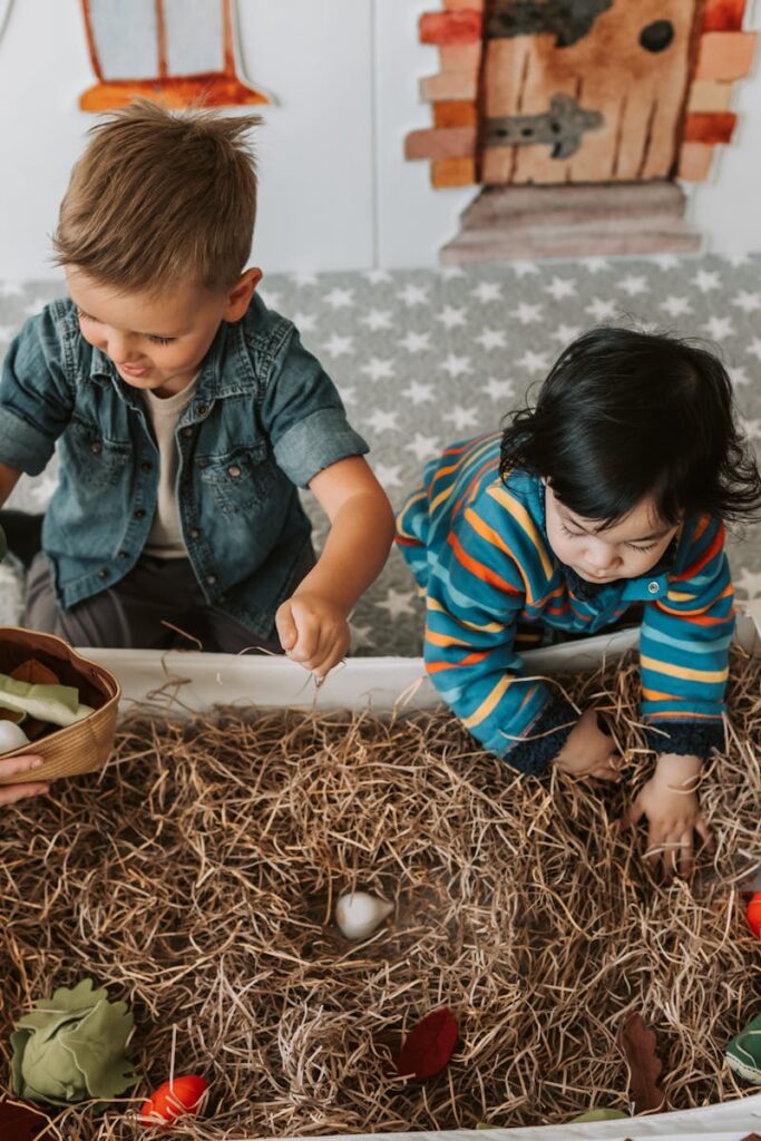 Children engaged in playful activities in a cozy indoor playroom full of toys and imagination.